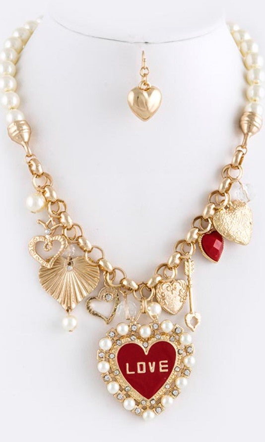 heart lined necklace with partial pearl chain and heart shaped earrings