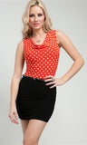 black dress with belted waist and orange and white polka dot bust